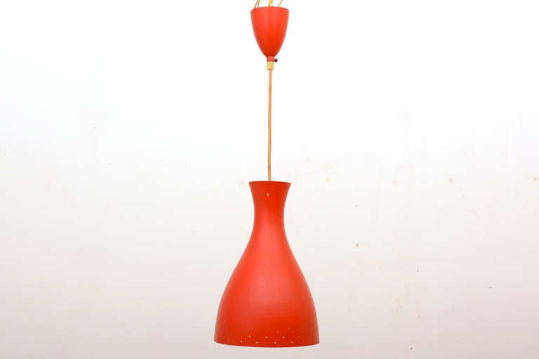 For your consideration a vintage hanging light fixture. Made in Italy. The shade and the canopy are made of spoon aluminum with original red paint and silk electric cord. 

The shade has a beautiful sculptural shape. Some perforation in the bottom