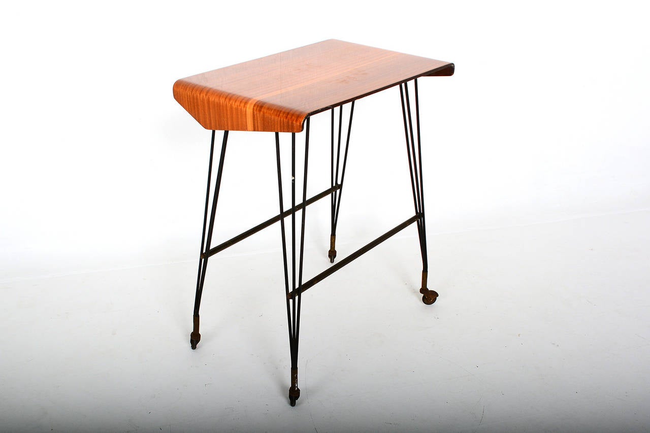 For your consideration:  Italian Side Table or Carrello TV.  
Very versatile in use; Stay at home TV Tray, Rolling Media Office Desk, Computer Media-Tech Table. On casters. No label present. Attributed to  Carlo Molino. Similar style designer