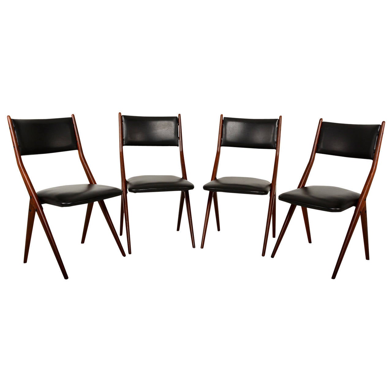 For your consideration a set of four mahogany chairs with faux black leather. 

Sculptural scissor shape. Firm and sturdy.

 