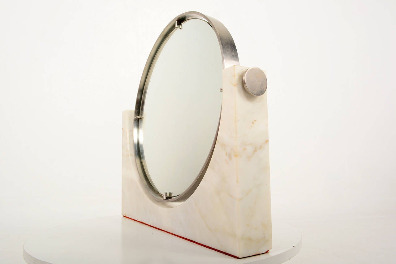 For your consideration a vanity mirror constructed with Carrera marble and stainless steel. Double sided.

Unmarked.

Italy circa 1960s.

