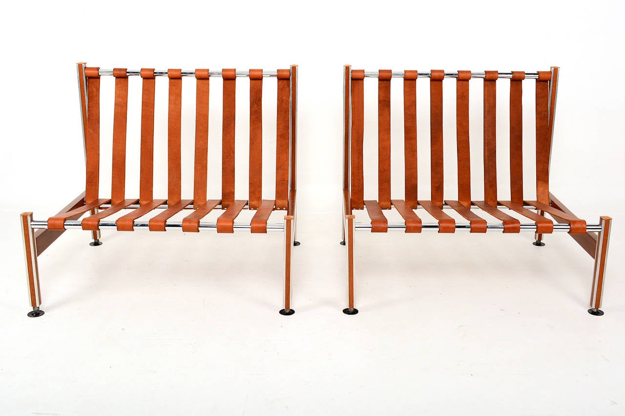 For your consideration, a pair of lounge chairs constructed with aluminum and mahogany frame.

Tanned leather straps are secured to three chrome-plated bars.
New cushions in black faux leather.
Made in Mexico circa late 1960s. Restored.
