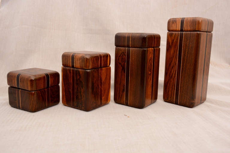 For your consideration a set of four canisters or boxes by Don Shoemaker. Mexico, circa 1960s. 
Beautiful craftsmanship with exotic woods. 

All boxes with matching lids. 

Three boxes have the original label underneath. 

Tallest to smallest