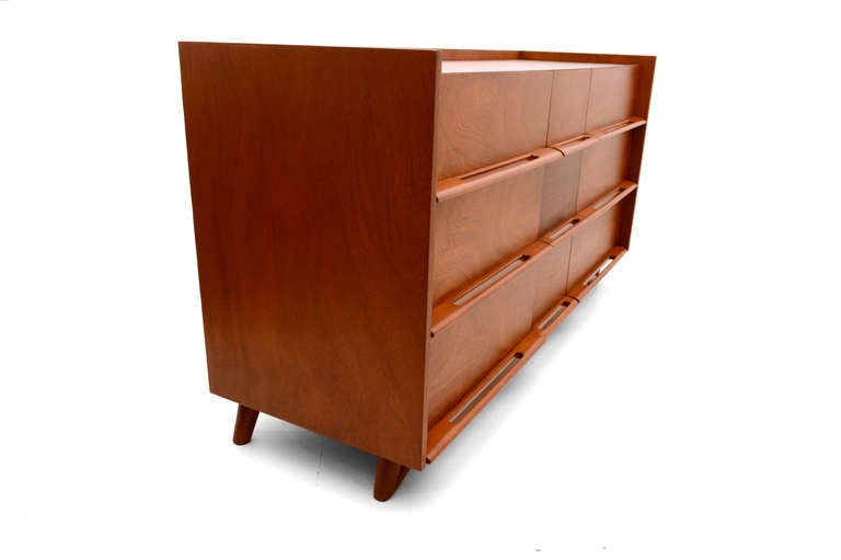 For your consideration a mid-century modern dresser attributed to Edmond Spence. No label from the maker present. 

Sculptural built in handles and sculptural 