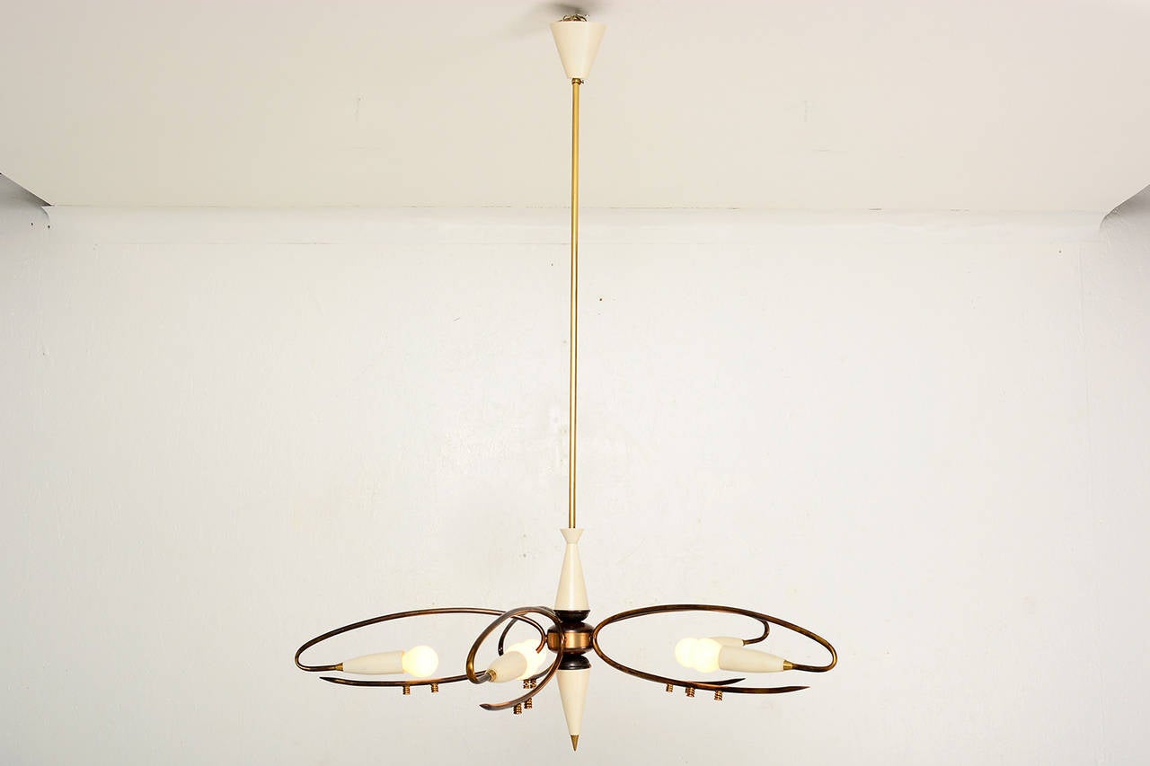 For your consideration a vintage Italian chandelier with five arms. 
Sputnik style with brass hardware and aluminum shades (painted in ivory color).

Unmarked.

41 1/2