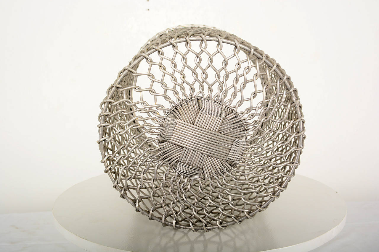 For your consideration a decorative waste basket constructed with aluminum wire. 
Unknown maker.