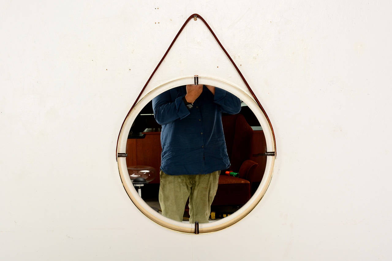 round mirror with leather hanging strap