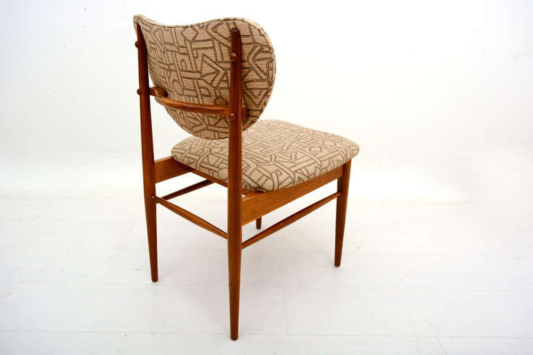 For your consideration, a set of six dining chairs designed by John Keal for Brown Saltman. 

Sculptural walnut frame. 

Chairs have the a unique upholstery pattern, which can be replaced to meet clients specs.