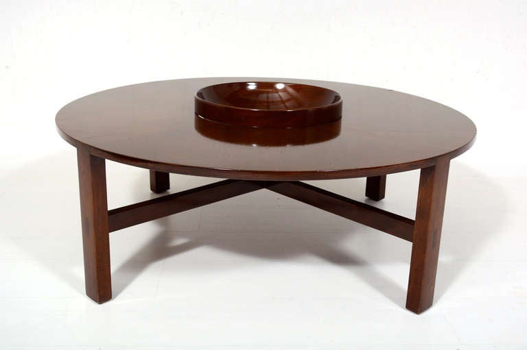 For your consideration a round cocktail/coffee table designed by Edmond Spence. 

Stamped with makers label underneath. 

The center piece has a removable bowl. 

Original finish, could be restored if desired.