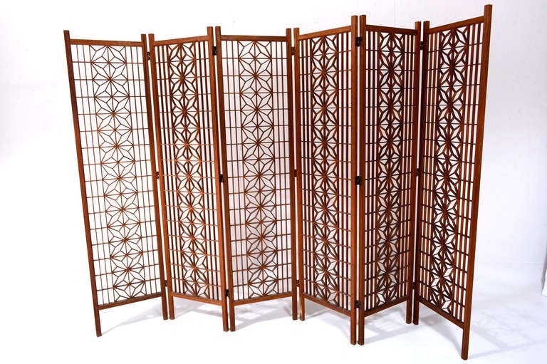 For your consideration a vintage room divider constructed with teak wood.

Six panel screen with beautiful pattern.

Each panel is 17 1/2