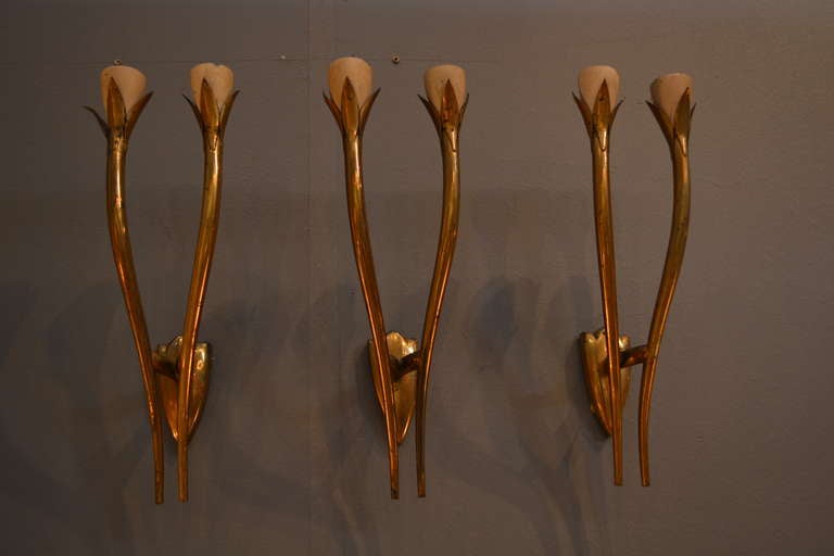 For your consideration a set of three wall sconces in the style of  Guglielmo Ulrich. Unmarked. 

Fine body sculptural design in solid brass with covers in aluminum (top section to cover the sockets) painted in off white color. 

Beautiful