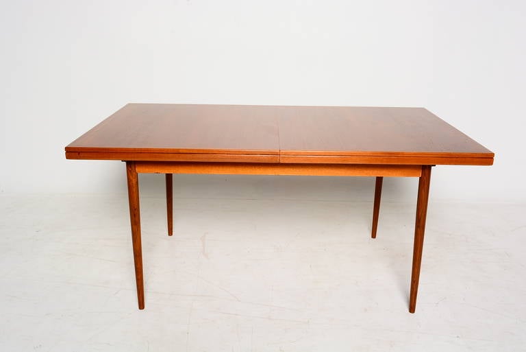 For your consideration a teak dining table in rectangular shape with built in extension.
Table dimensions: Closed is 63