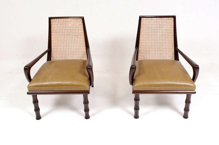 For your consideration a pair of lounge chairs attributed to Eugenio Escudero.

Beautiful sculptural design in solid mahogany wood. New leather cushion seats and hand woven cane.


