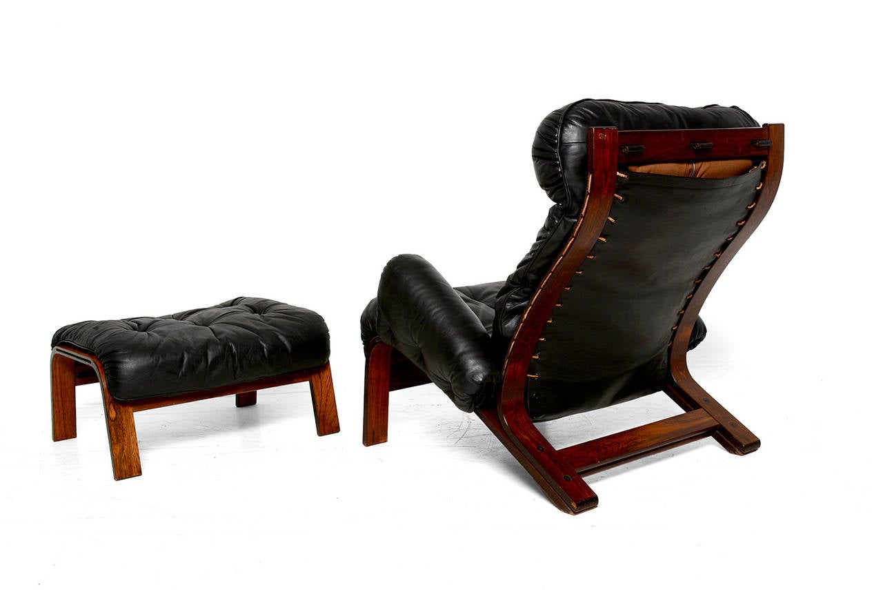 Late 20th Century Scandinavian Lounge Chair and Ottoman in Rosewood and Black Leather