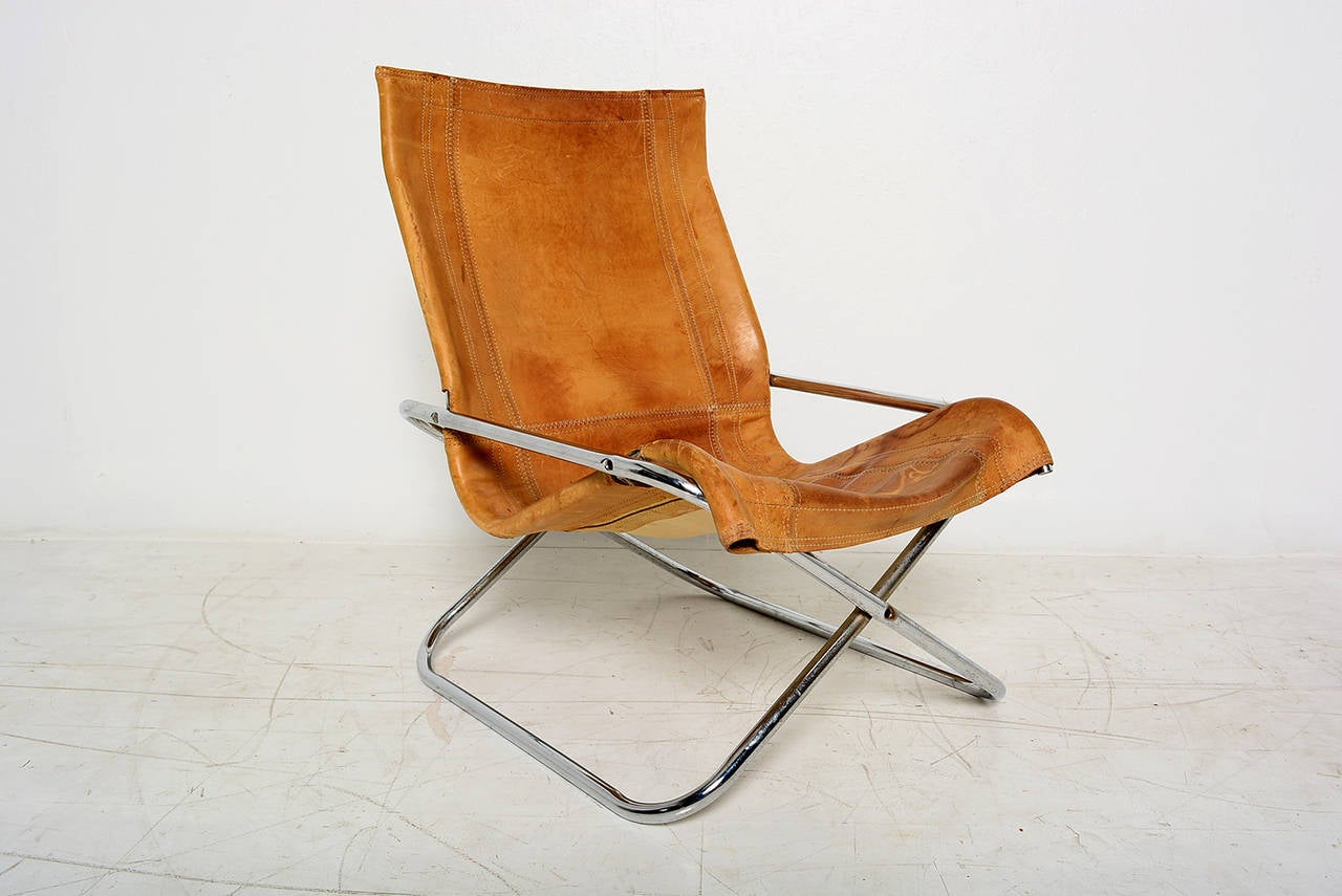 For your consideration a vintage X folding chair by Takeshi Nii with Buffalo leather and chrome plated steel frame.