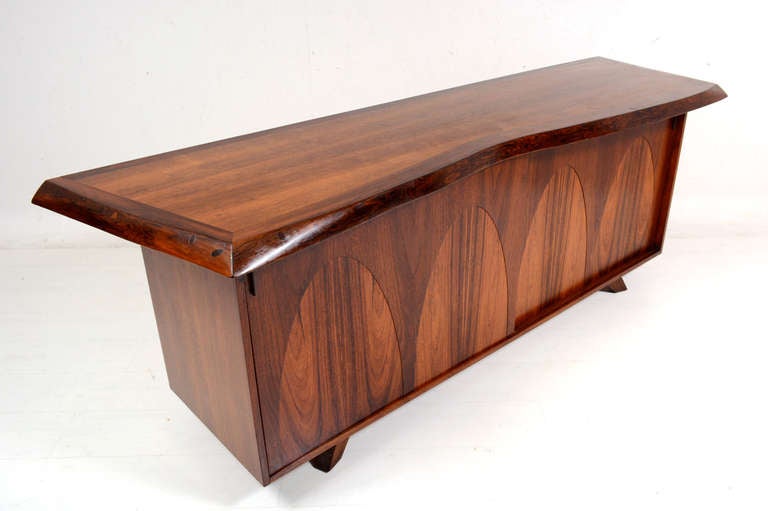 For your consideration a beautiful rosewood & walnut credenza. 
Custom made for the Price family by Robert Loos.

Robert Loos created this piece for the Price Family in Santa Barbara CA mid 1960s. 

Former aeronautic engineer, after the end of