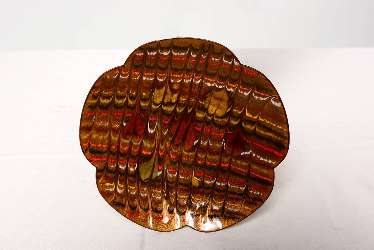 For your consideration a custom enamel plate signed on the back. 
Front has a brown tones, white, red, black tones. Dominant tone is brown. 
Back js green with some black accents.