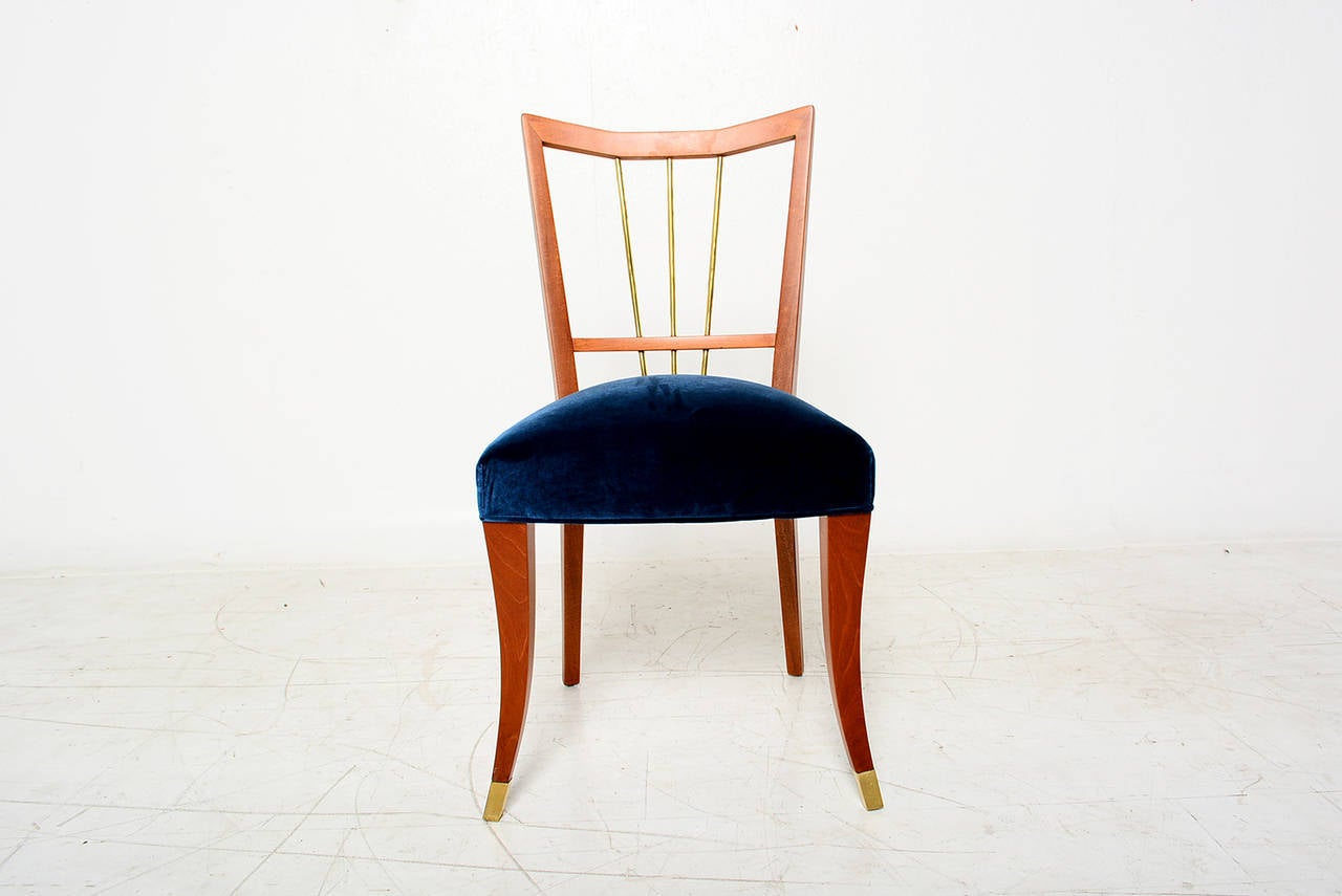 For your consideration a set of six dining chairs designed by Arturo Pani.

Mahogany wood with brass accents. New blue upholstery.

Excellent condition.