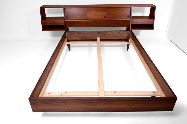 For your consideration a full size platform bed with floating nightstands.

Headboard has a storage with three sliding doors and the floating nightstands. Pull out drawers has double double dove tail joint construction and the open with