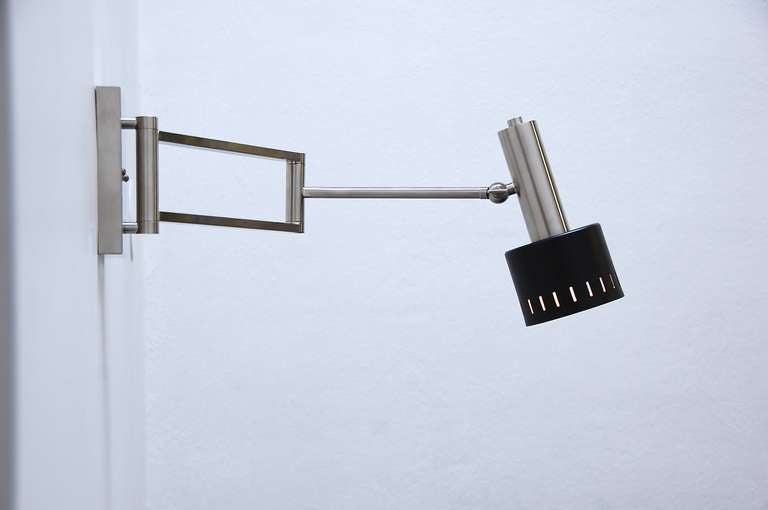 Strong and masculine articulated wall sconce from Germany in a brushed nickel finish.

Shade width: 5