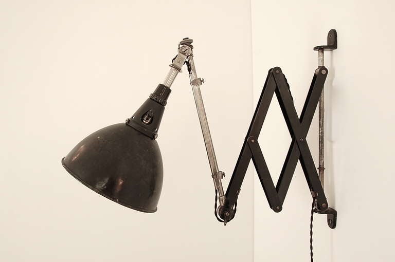 Black enamel and steel wall mount expanding and adjustable light by Carl Fischer for Midgard.
Length: 42