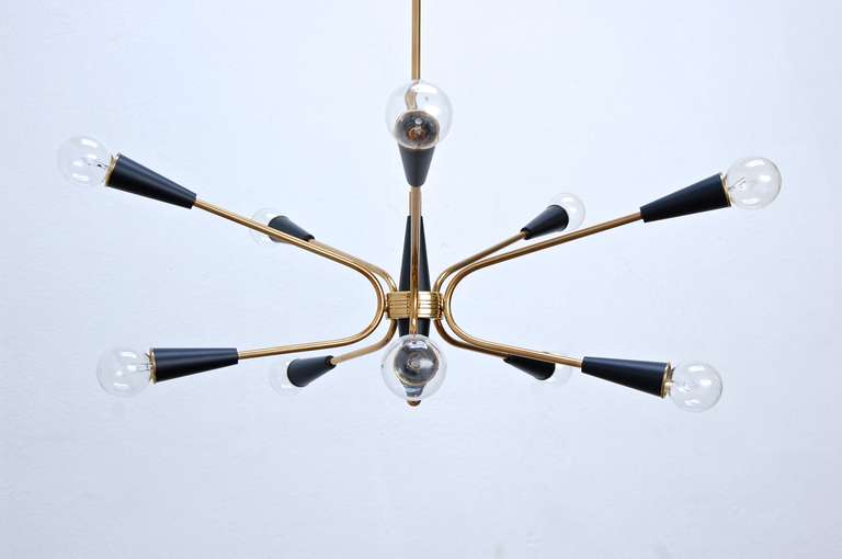 Modest and elegant 10-arm sputnik chandelier from Italy.

Overall drop: 22