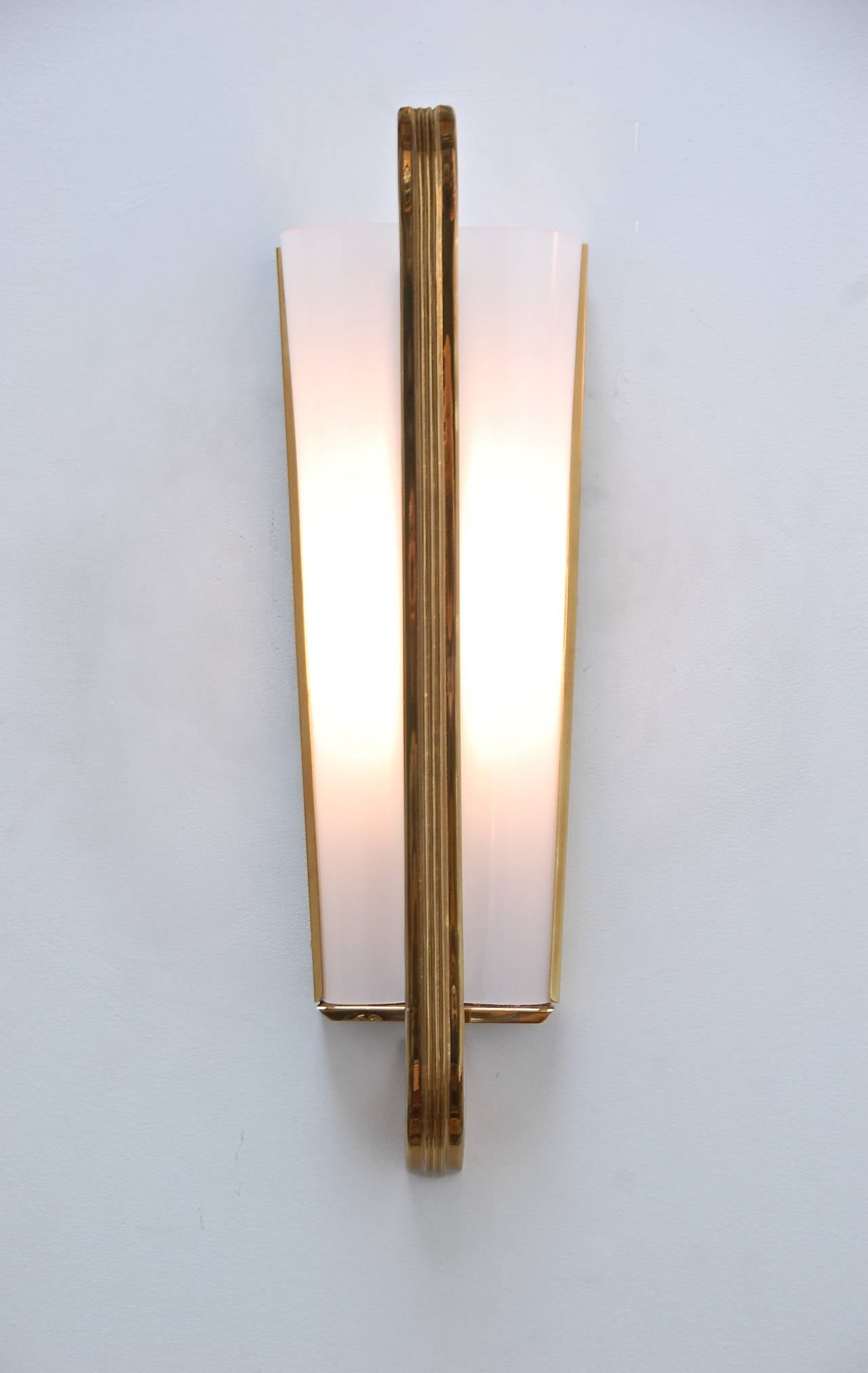 Elegant single brass and Lucite sconce from Italy. Rewired for use in the US.