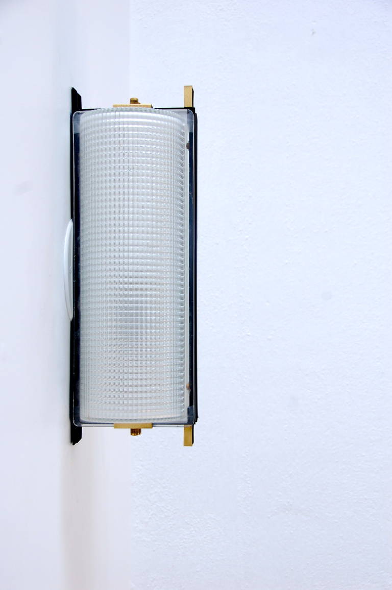 Captivating linear wall sconces with  beautifully impressive holophane glass shades from Sweden. Can also be used outdoors in a covered area to accent an environment.
