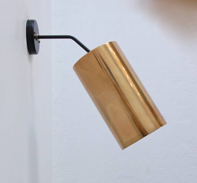 A pair of large cylinder pivot sconces in brass and steel by Boris Jean Lacroix. Shades are directional with pivots.