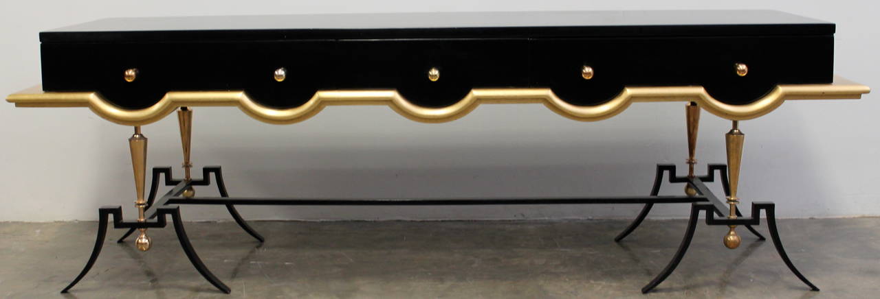 Stunning black lacquered mahogany, iron, brass and gold leaf low console. 
By Arturo Pani
In the style of Jean Royère.
Beautiful iron and solid brass base.
Mexico City, circa 1950s.

Arturo Pani (1915-1981) was born in Mexico City to a