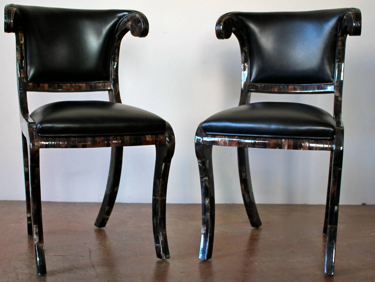 Beautiful pair of tessellated and black leather sculptural chairs.
By Enrique Garcel.
Made in Colombia in 1970s.