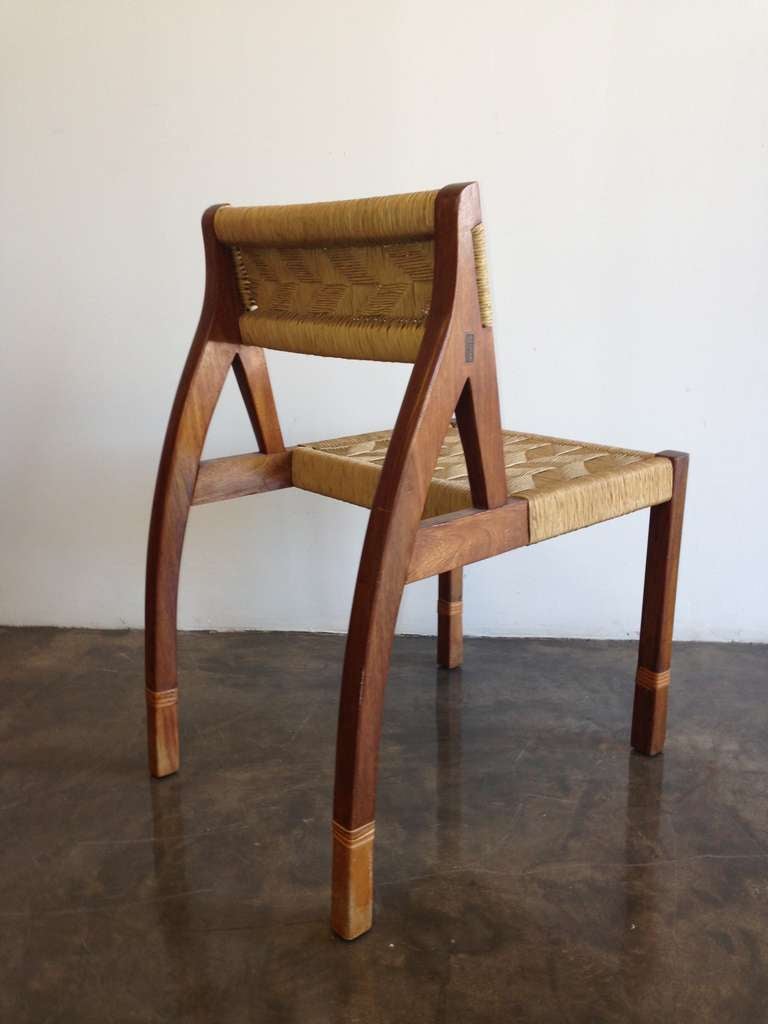 Rare Mexican Mid Century Modernist Dynamic Side Chair
Mexican Blond Mahogany, Wooven Cane Seat
Made in Tlaquepaque Jalisco Mexico c.1950
Original Label: Fabrica de Muebles 
