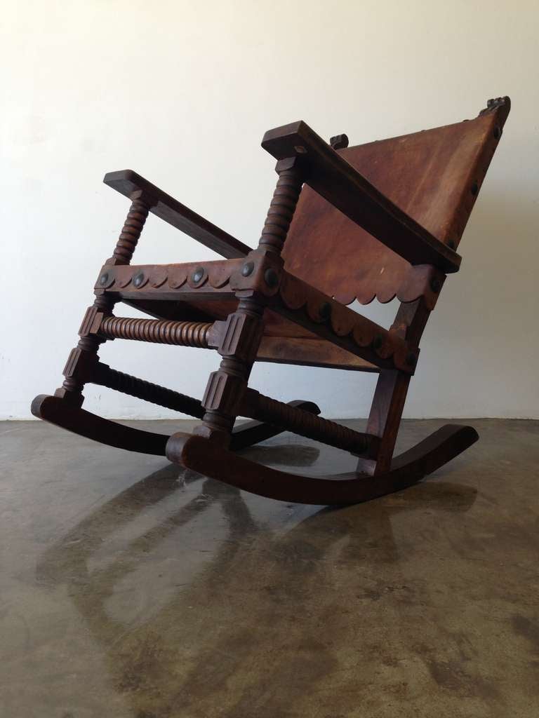 Beautiful Spanish Style Mexican Rocking Chair,Rare Venadillo Wood ( from the state of Sinaloa,Mexico) and Leather.
 Nice Arrangement of Original Brass Studs.
 Original Label: Campos Colonial Furniture, Mexico.
 c.1940's