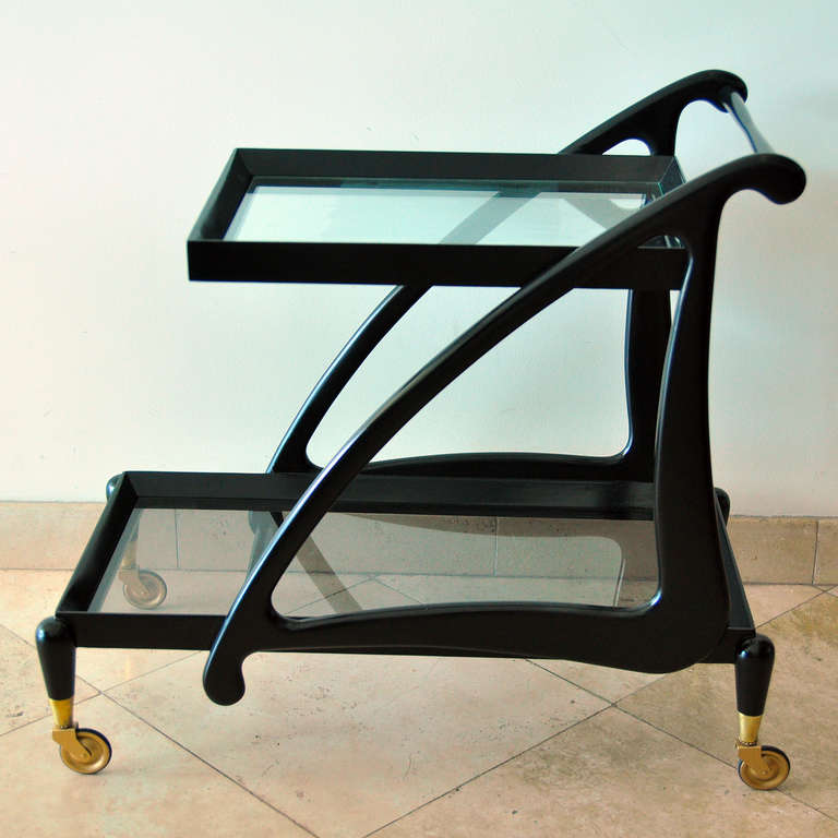 Eugenio Escudero bar cart.
Mexico, circa 1950s.
Black lacquered mahogany wood and glass.