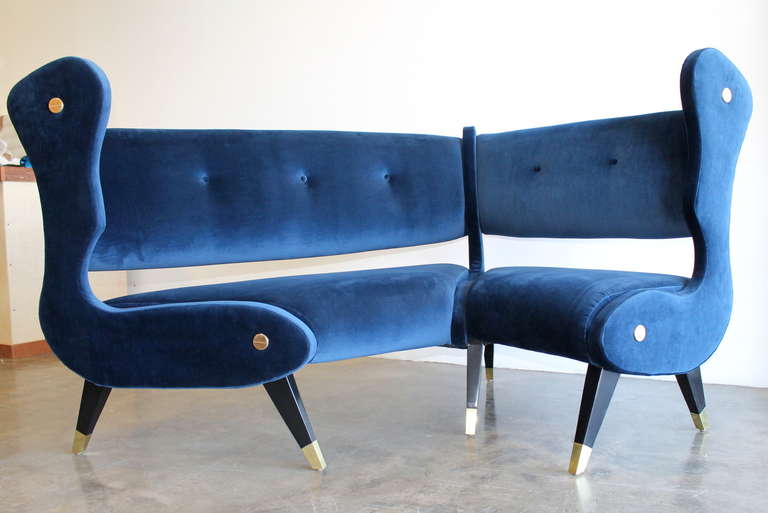 Uniquely designed Italian modernist wingback angular or corner sofa, 
circa 1950s. 
Blue velvet with angular lacquer feet and solid brass sabots and accents.
Unknown Designer.
In the style of Gio Ponti, Osvaldo Borsani or Marco Zanuso.