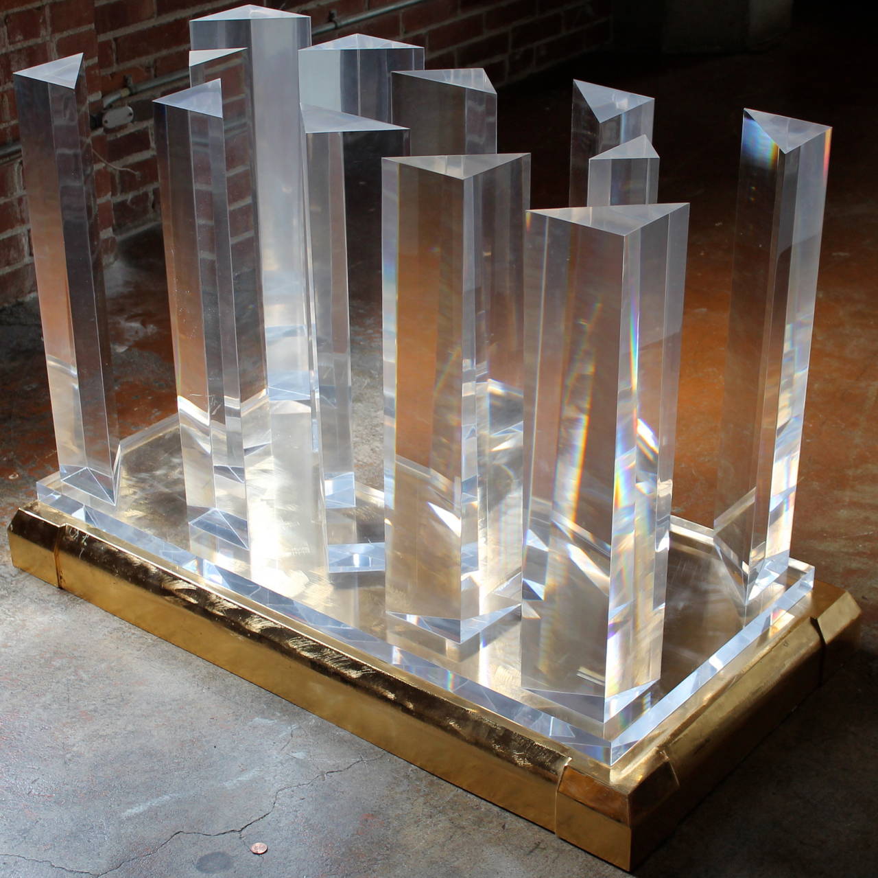 Beautiful Lucite and Brass Cityscape dining table attributed to Jeffrey Bigelow. 
Plated brass and brushed base.
90