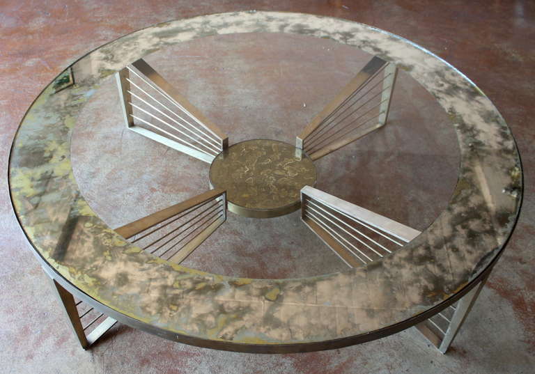 Beautiful and rare bronze and eglomisé glass coffee table with four harp shaped bases. A wonderful vintage patina or can buffed to a high shine.
By Arturo Pani.
Mexico City, circa 1950s.

