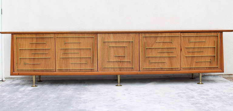 Rare monumental Custom Buffet or Credenza 
By Mexican Architect Eugenio Escudero.
Mexico City. circa 1950s
Mexican Mahogany, Brass Inlay, Bronze Accents and Oversized Trompet Sabots.