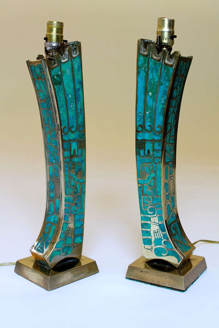 Stunning table lamps by Mexican artist Pepe Mendoza.
Cast in bronze and with turquoise composite inlay. Very rare and an incredible display of the artists inspiration in Mayan culture and modernism of Mexico City from 1950's.
Recently rewired.