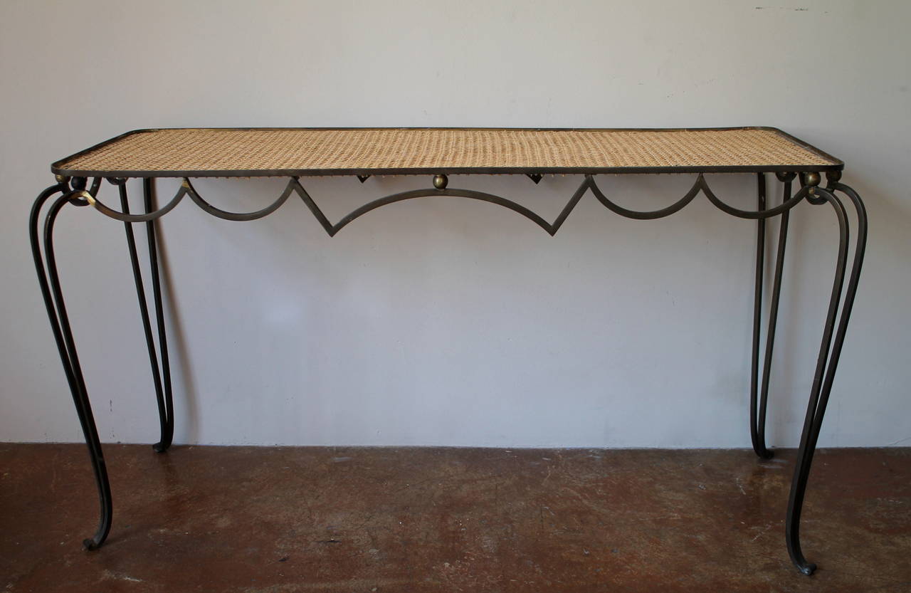 Stunning and rare bronze and wicker small console table
by Arturo Pani.
Mexico City, circa 1940s.

Arturo Pani (1915-1981) was born in Mexico City to a well-known diplomatic family. At the age of 4 in 1919 he travelled with his family to live in