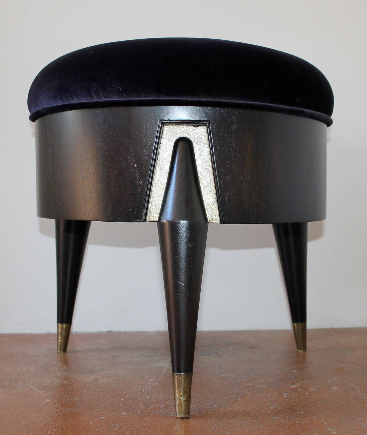 1950s Mexican modern Eugenio Escudero single low velvet stool.
Freshly reupholstered and refinished, original brass casters.