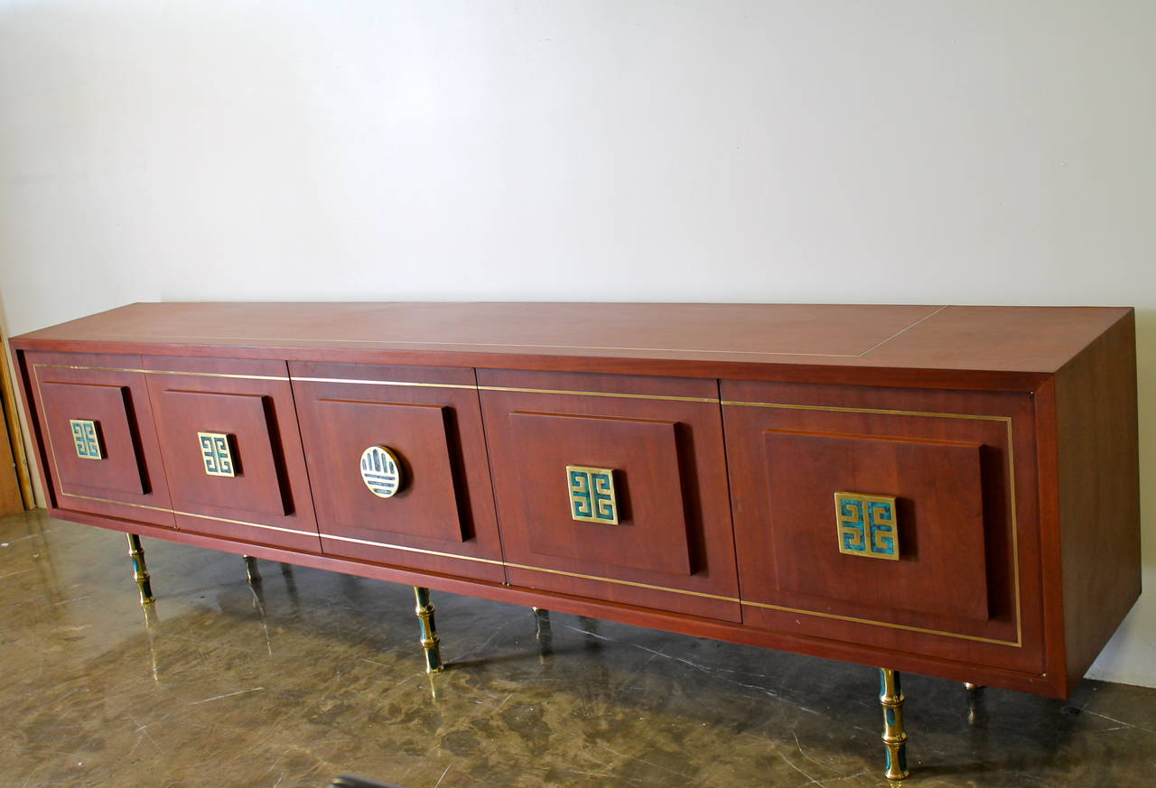 Stunning and rare mahogany 10 feet long credenza designed by Frank Kyle.
Custom-made in Mexico City, circa 1950s.
Beautiful hardware and legs designed by Frank Kyle and made in the workshop of Pepe Mendoza.
Four solid brass Greek key pulls and