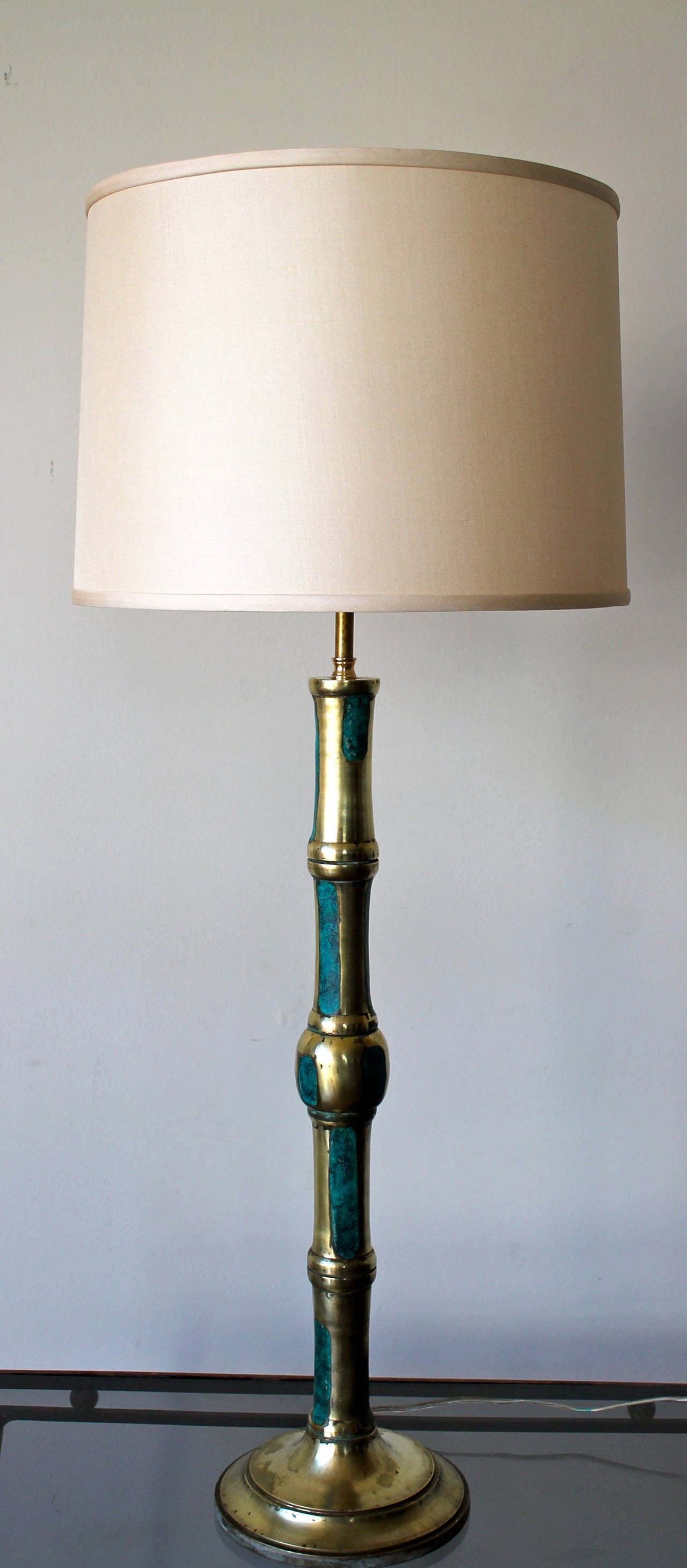 Beautiful and rare set of two bamboo cast brass table lamps with ceramic turquoise inlay.
By Pepe Mendoza.
Mexico City, 1959.
Each lamp is signed Pepe Mendoza, Mexico.
Completely restored and rewired.
Brand new silk shade lamps made in USA.