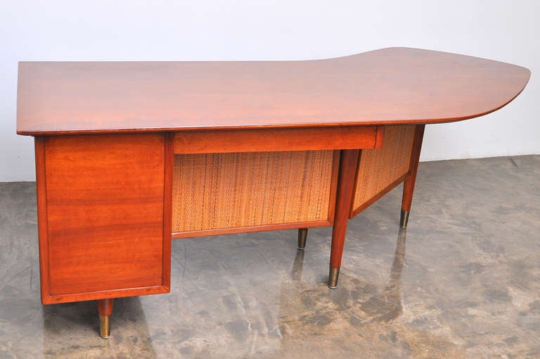 1950's American Boomerang Shaped Walnut and Cane Executive Desk In Excellent Condition In San Diego, CA