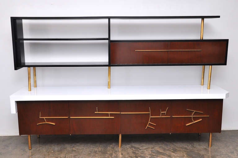 Original Rare  Custom Made Credenza with Floating Hutch and Bar. Four storage compartments on the bottom. Hutch is with shelves and a bar that opens downward and is lined with original vintage mirror. Bronze abstract lines on all doors. 

By