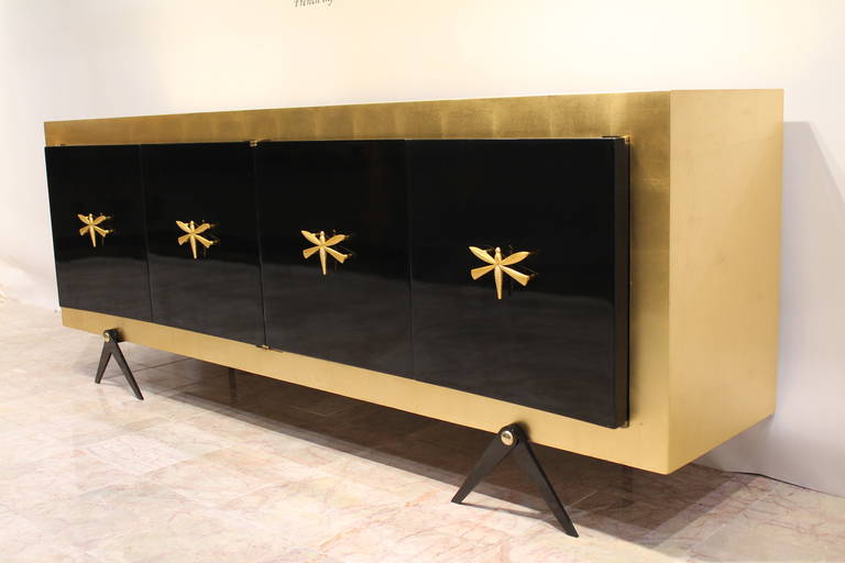 Exquisite Custom Made Gold Leaf and Black Lacquer Credenza or Buffet. 

by Arturo Pani.                      

Mexico City,  circa 1950.

Mahogany covered in Gold Leaf and Black Lacquer.

Beautiful Whimsical Dragonfly Pulls covered in 23