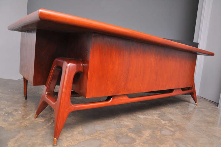 Mexican Mid-Century Modern mahogany bar with right return by Eugenio Escudero.
 Mexico City, circa 1950s.
 This is a truly amazing vintage bar is made from Mexican mahogany and brass.
 Sleek Mid-Century Modern look.