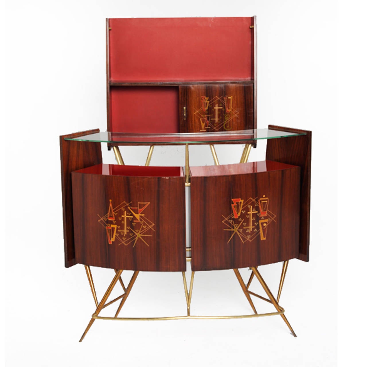 Dry bar composed by bar and back shelves made in solid wood and covered in rosewood. Geometrical decorative pattern in front and finished in brass. Italy 1950’s.