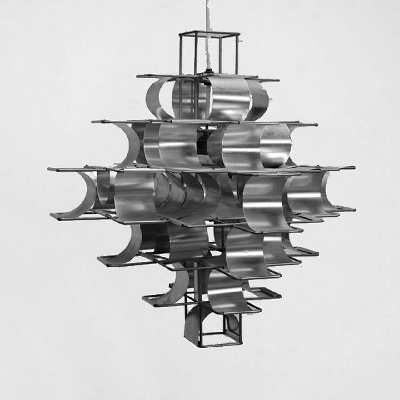 Ceiling lamp mod. “Cassiope” designed by Max Sauze, with structure made in plicate iron and bent aluminium.