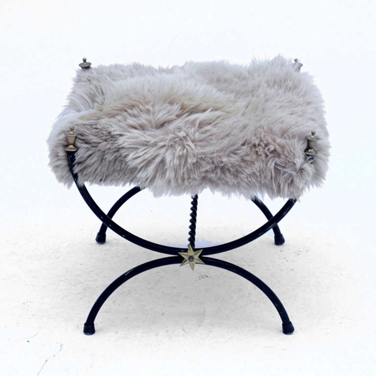 Footrest style Jean Royère made in iron with decorations in brass and bronze and Seat in natural Mogolia’s goal fur. France 1940’s