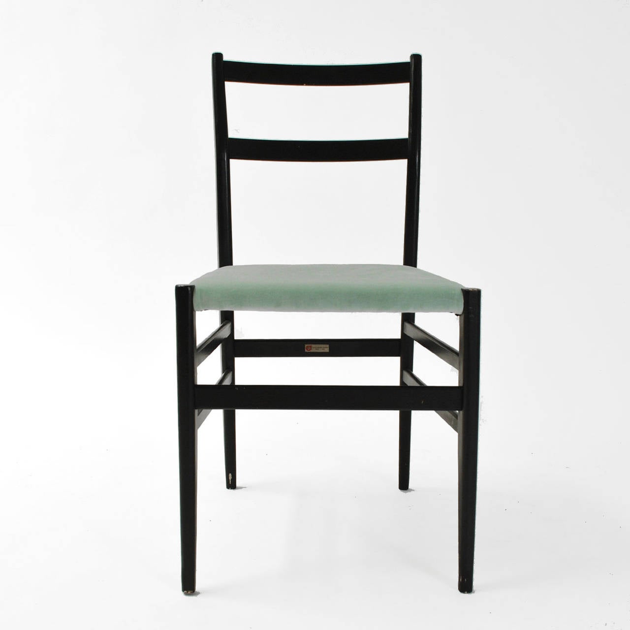 Set of six chairs Leggera model designed by Gio Ponti and edited by Cassina . Made of black lacquered ash wood with seat in green mint velvet cotton. Italy 1950 .